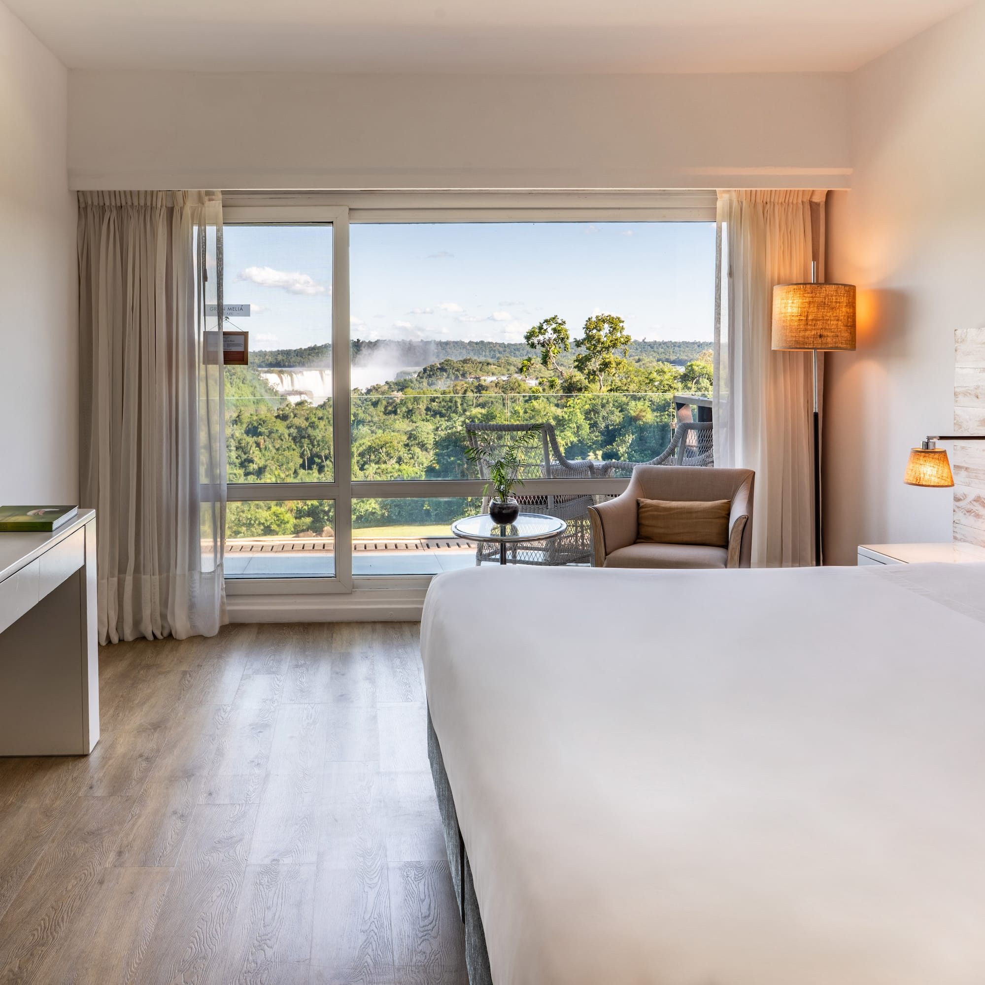 a room with a bed and a desk and a chair