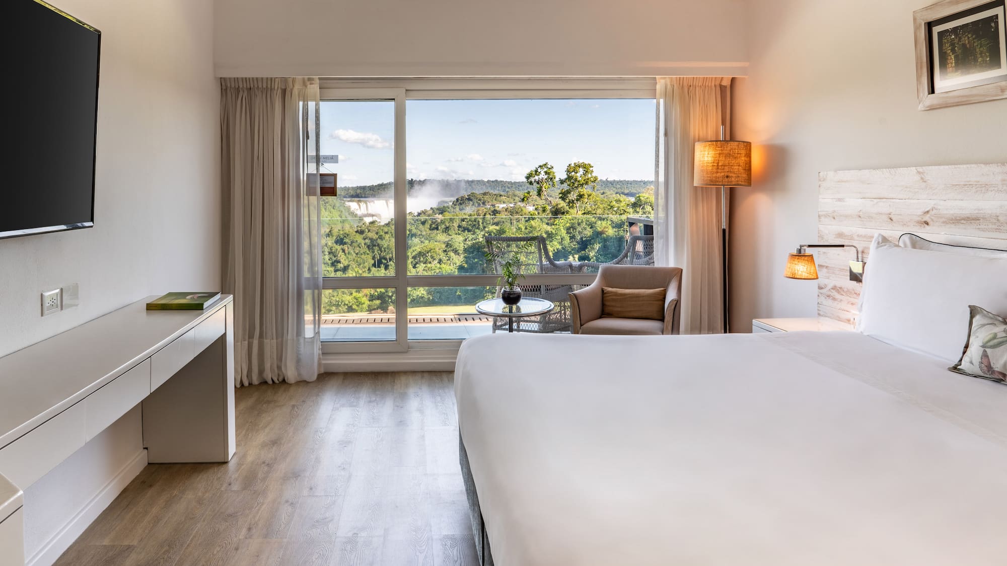 a room with a bed and a desk and a chair