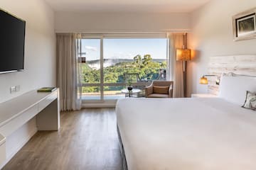 a room with a bed and a desk and a chair