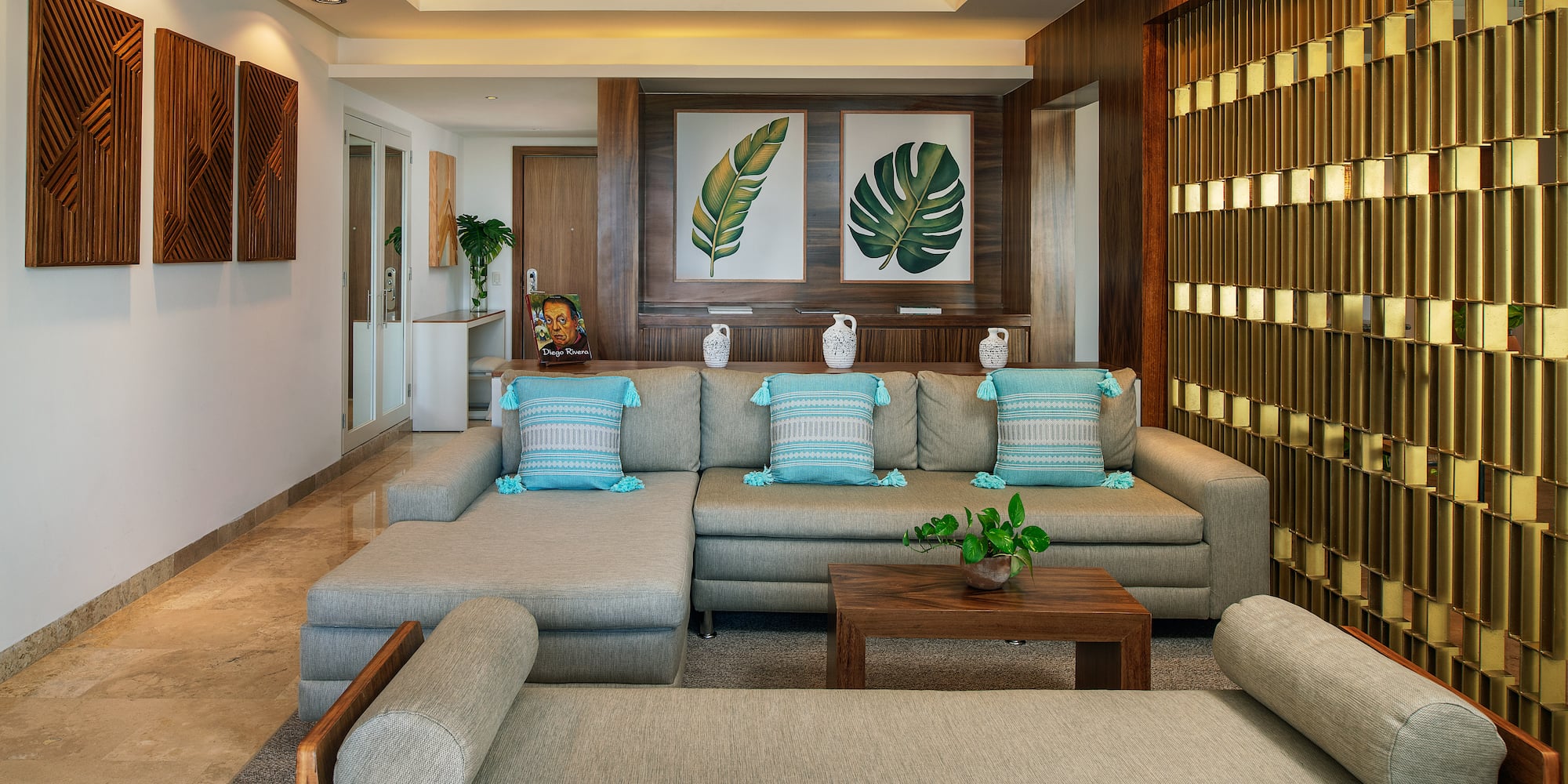 a living room with a large couch and a table