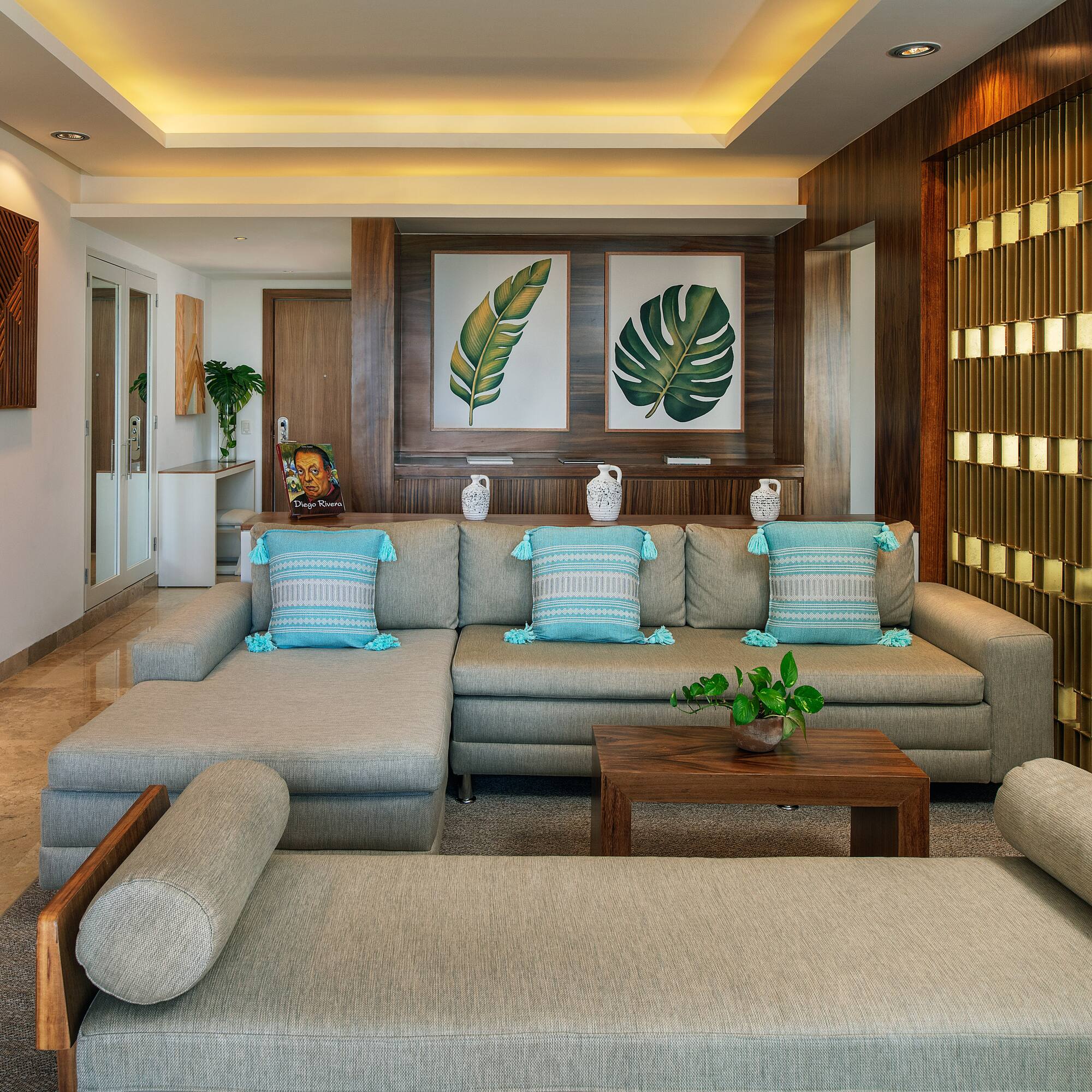 a living room with a large couch and a table