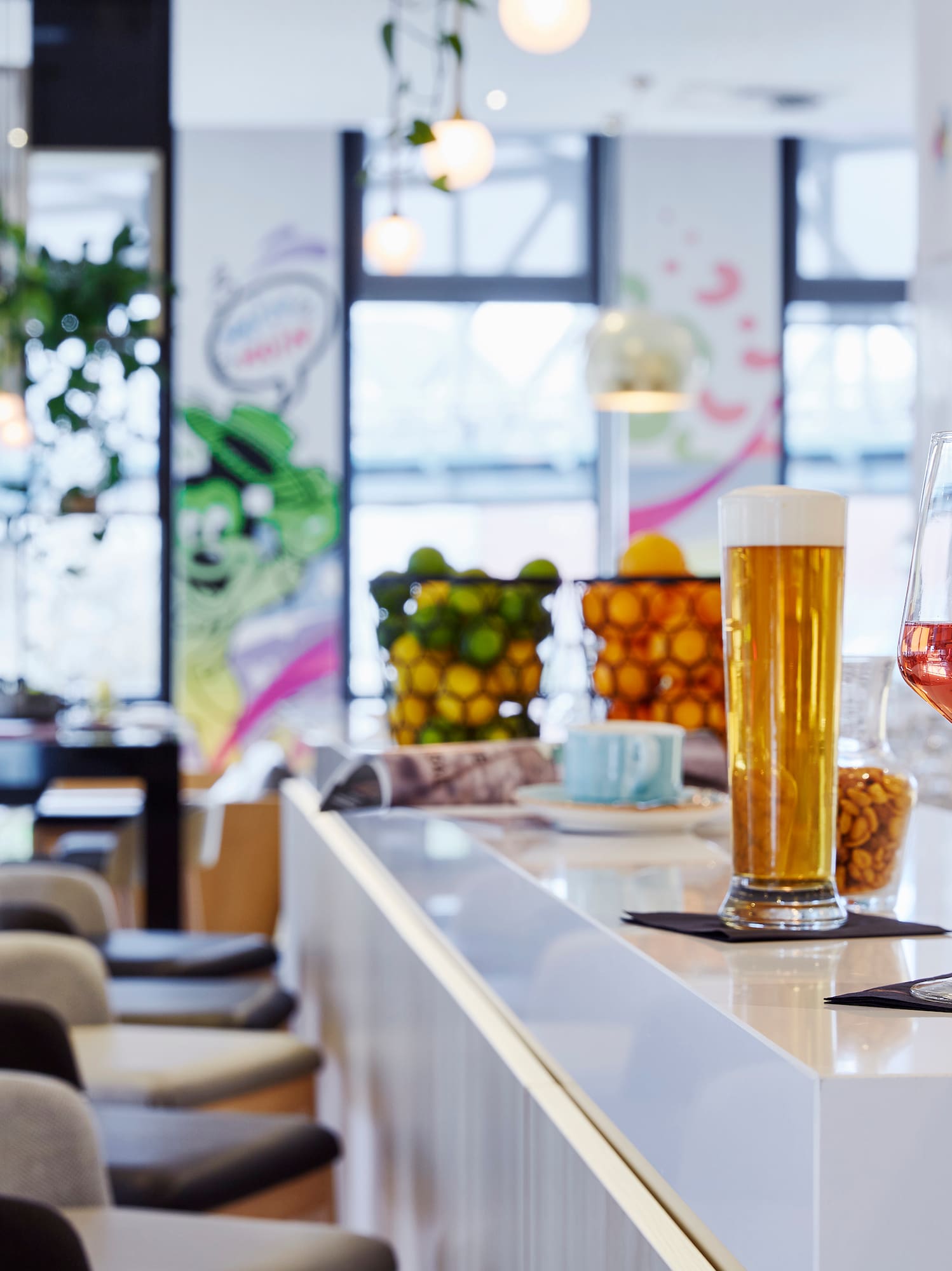 a hand holding a glass of wine