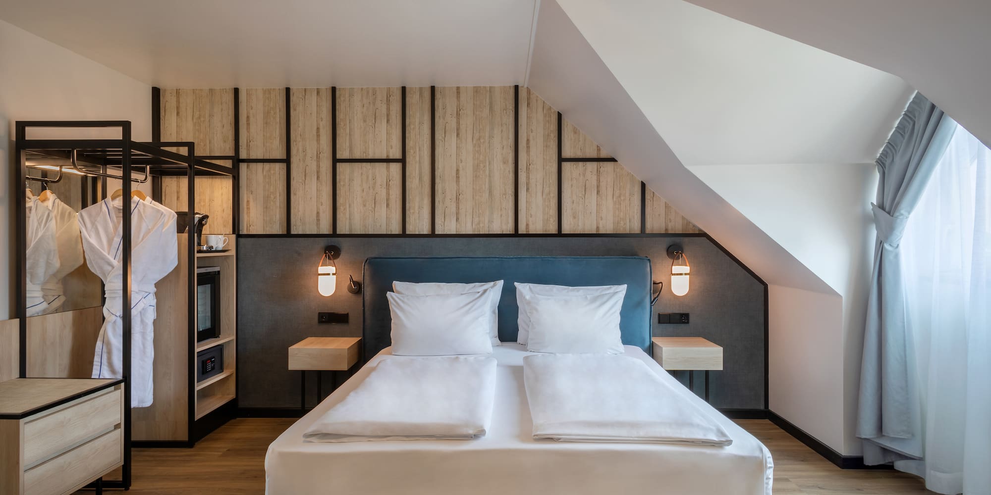 a bedroom with a bed and a wall