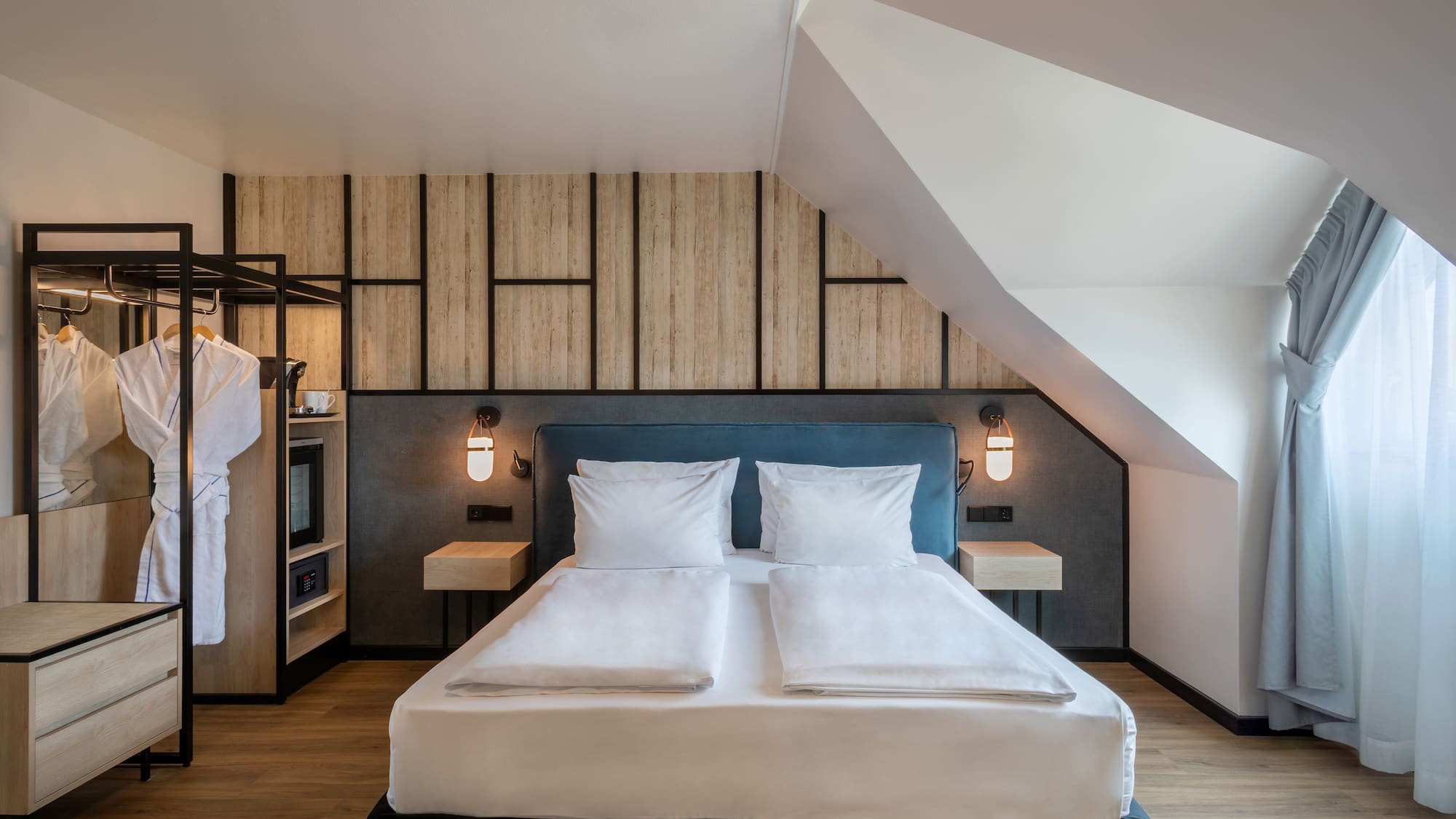 a bedroom with a bed and a wall