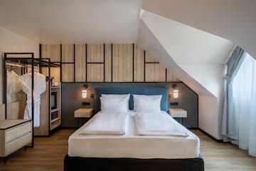 a bedroom with a bed and a wall