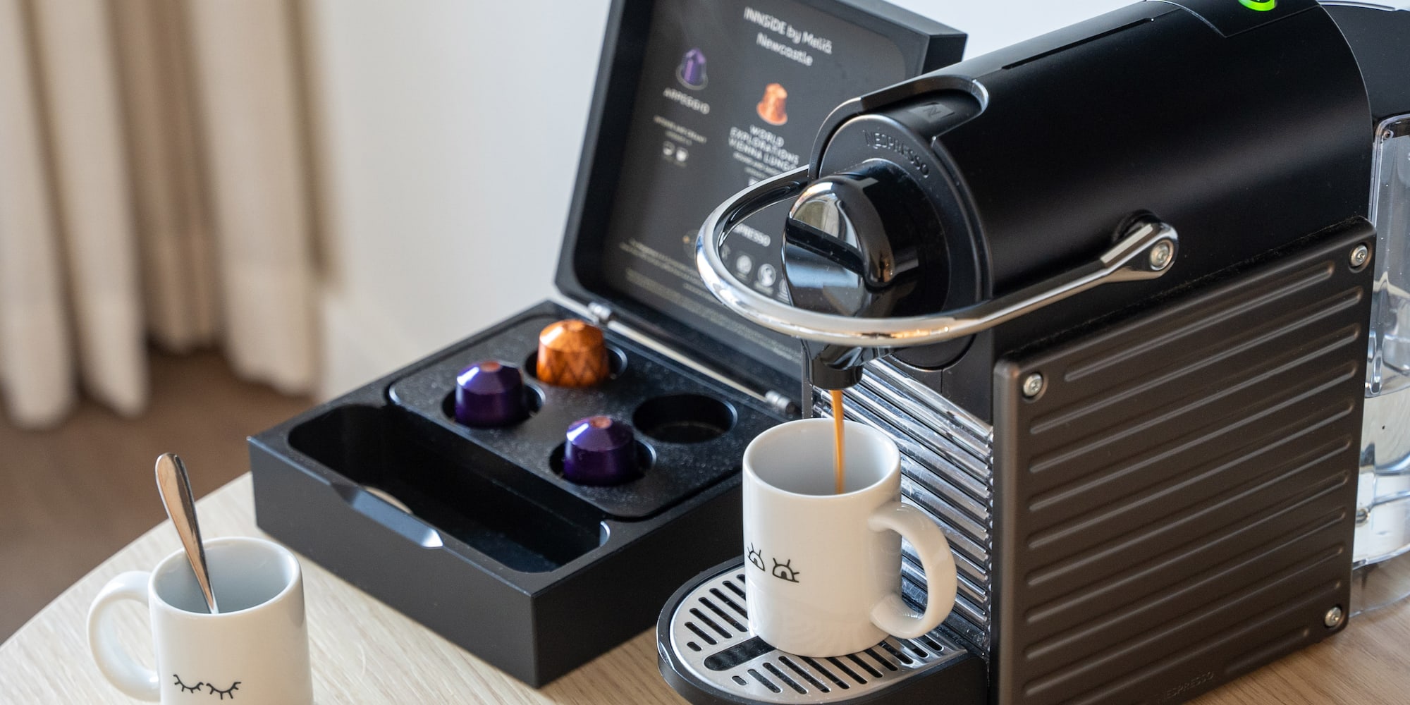 a coffee machine with a cup of coffee