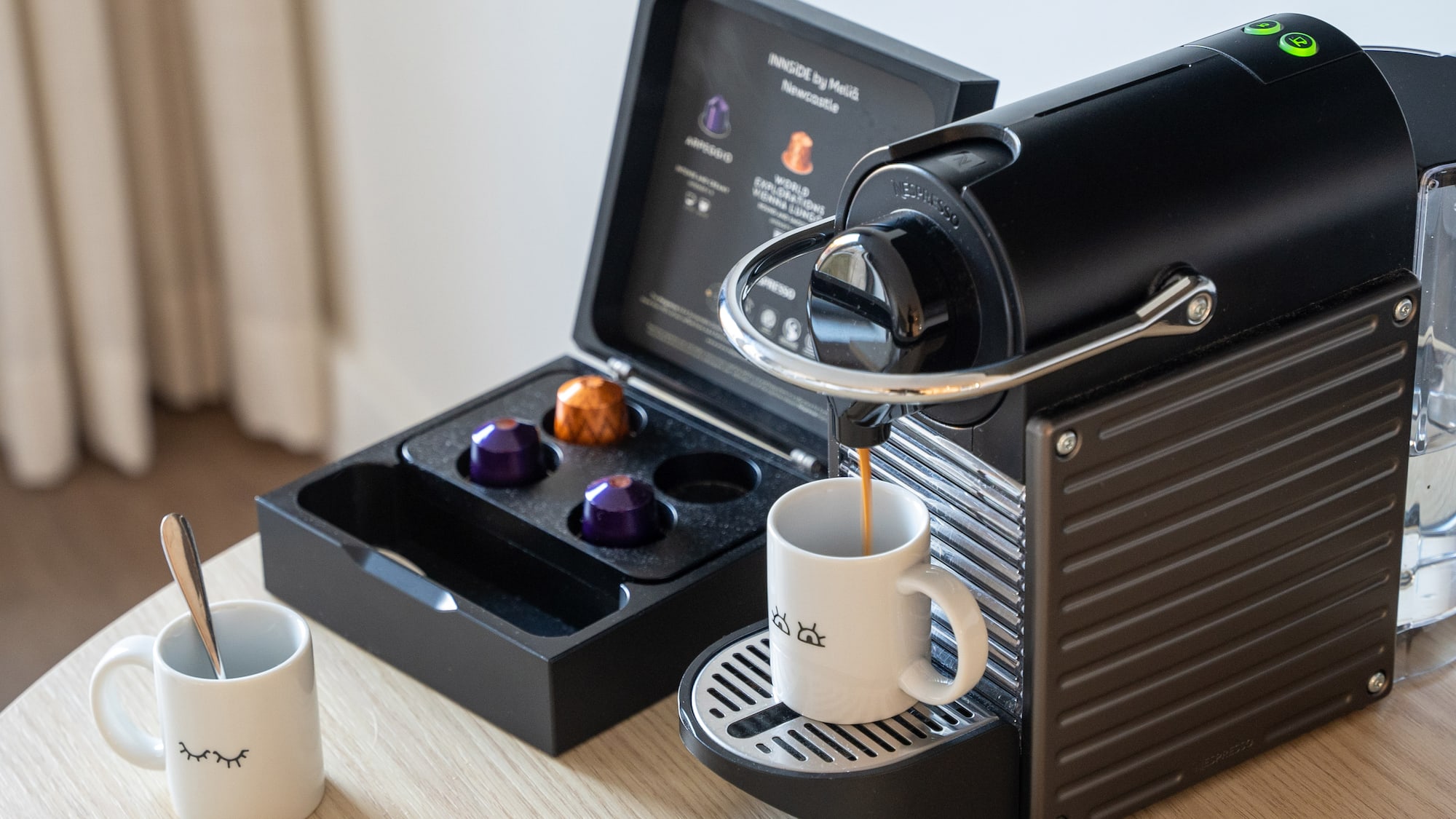 a coffee machine with a cup of coffee