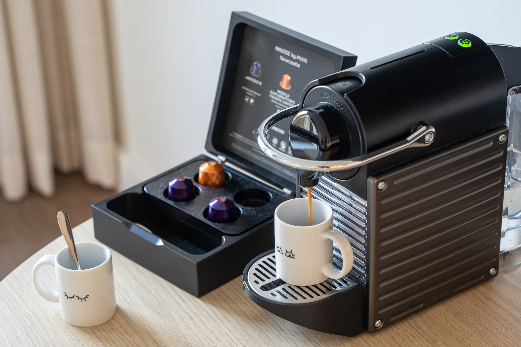 a coffee machine with a cup of coffee