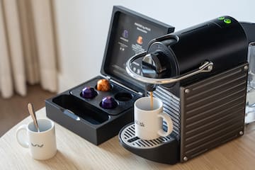 a coffee machine with a cup of coffee