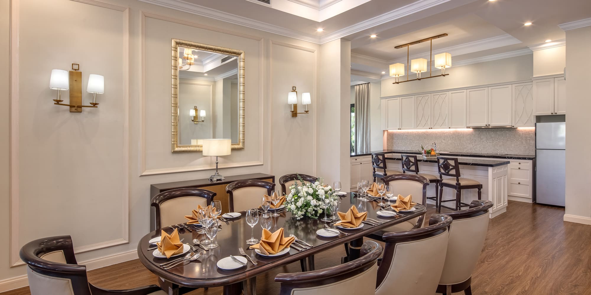 a dining room with a table and chairs