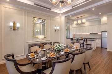 a dining room with a table and chairs
