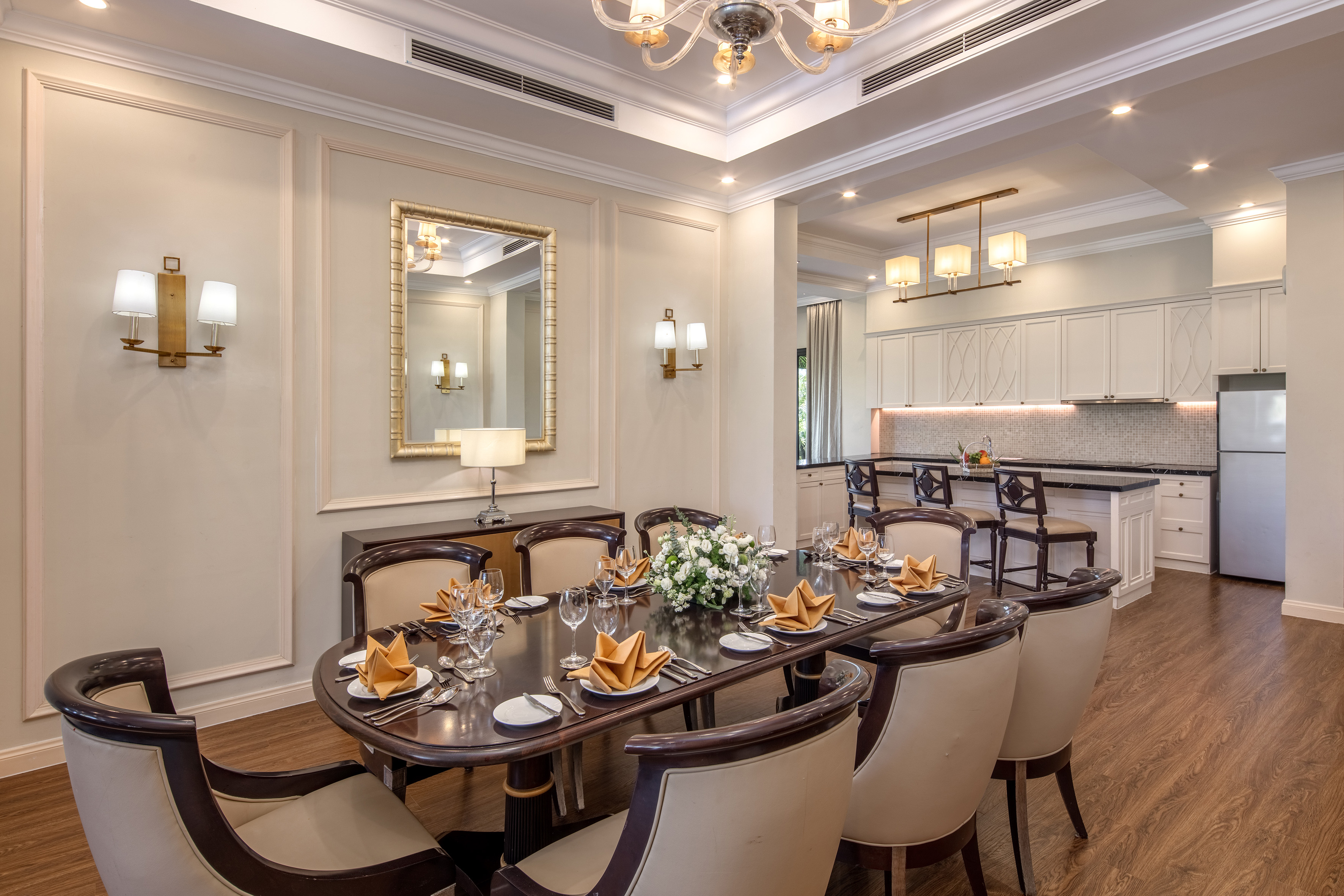 a dining room with a table and chairs