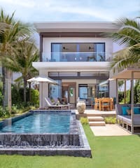 a pool in front of a house