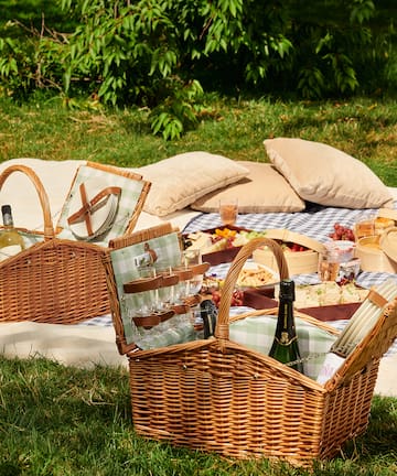 picnic basket on a blanket
