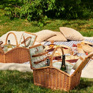 picnic basket on a blanket
