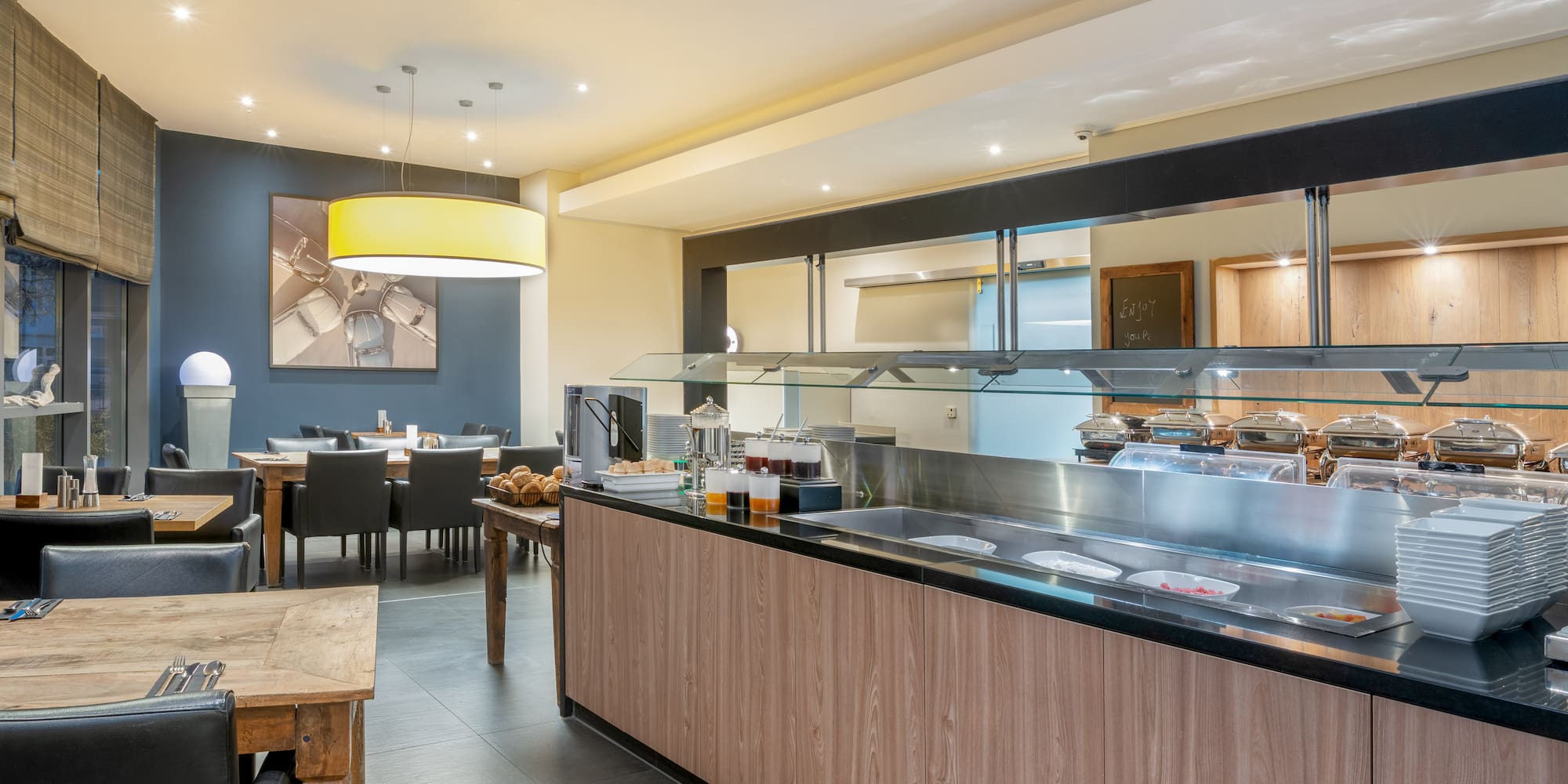 a restaurant with a buffet and a table