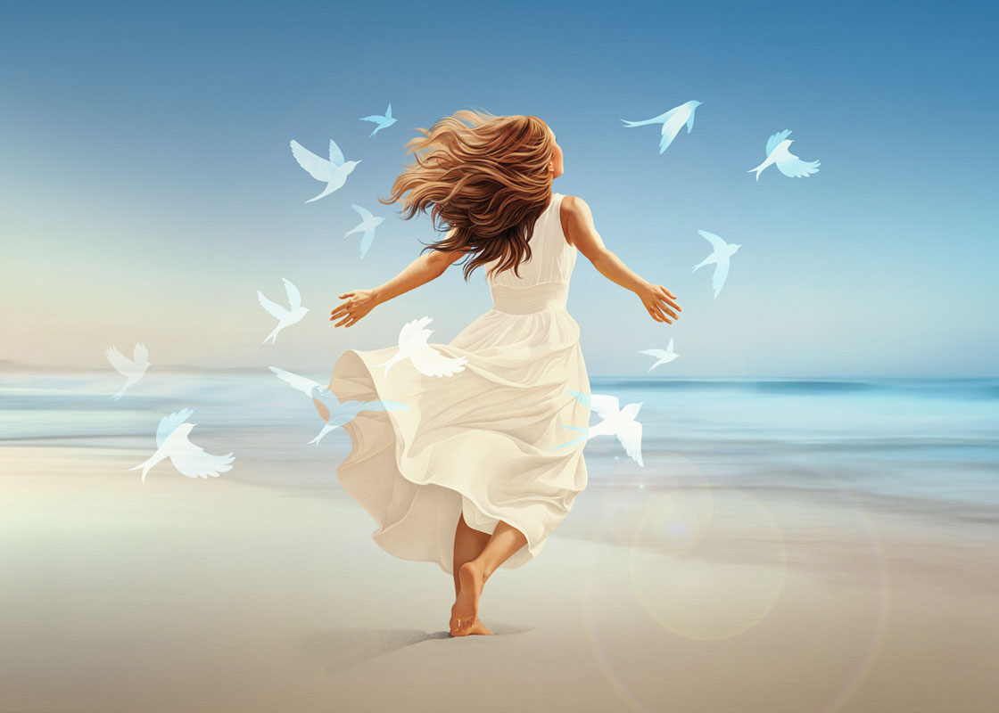 Woman in flowing white dress, barefoot on beach, with birds, ocean backdrop.