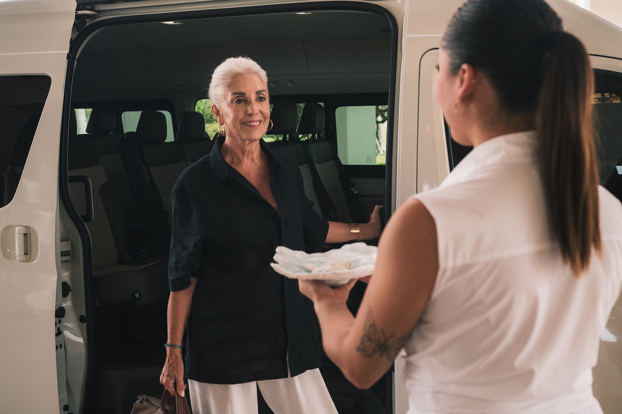a woman getting into a van