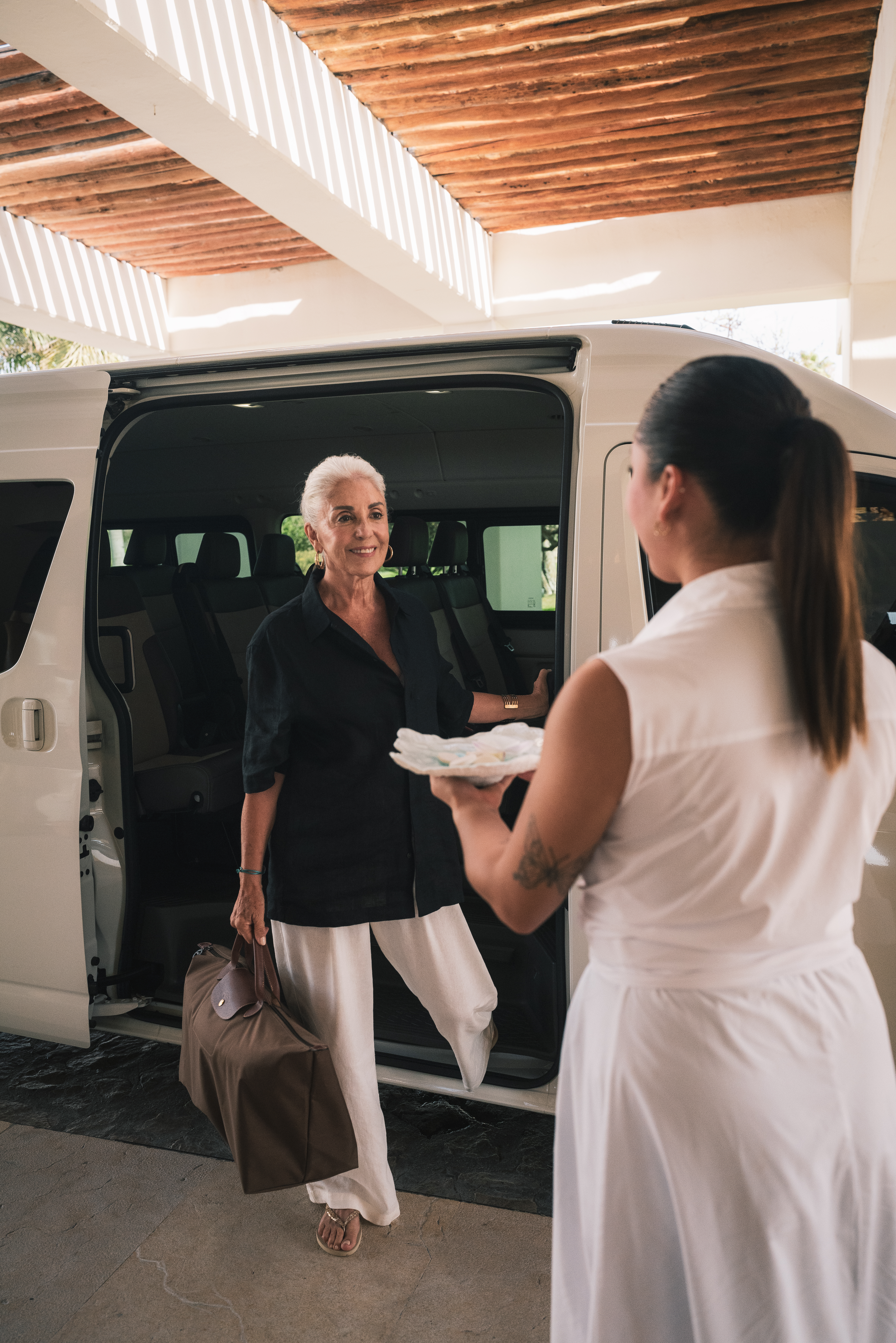 a woman getting into a van