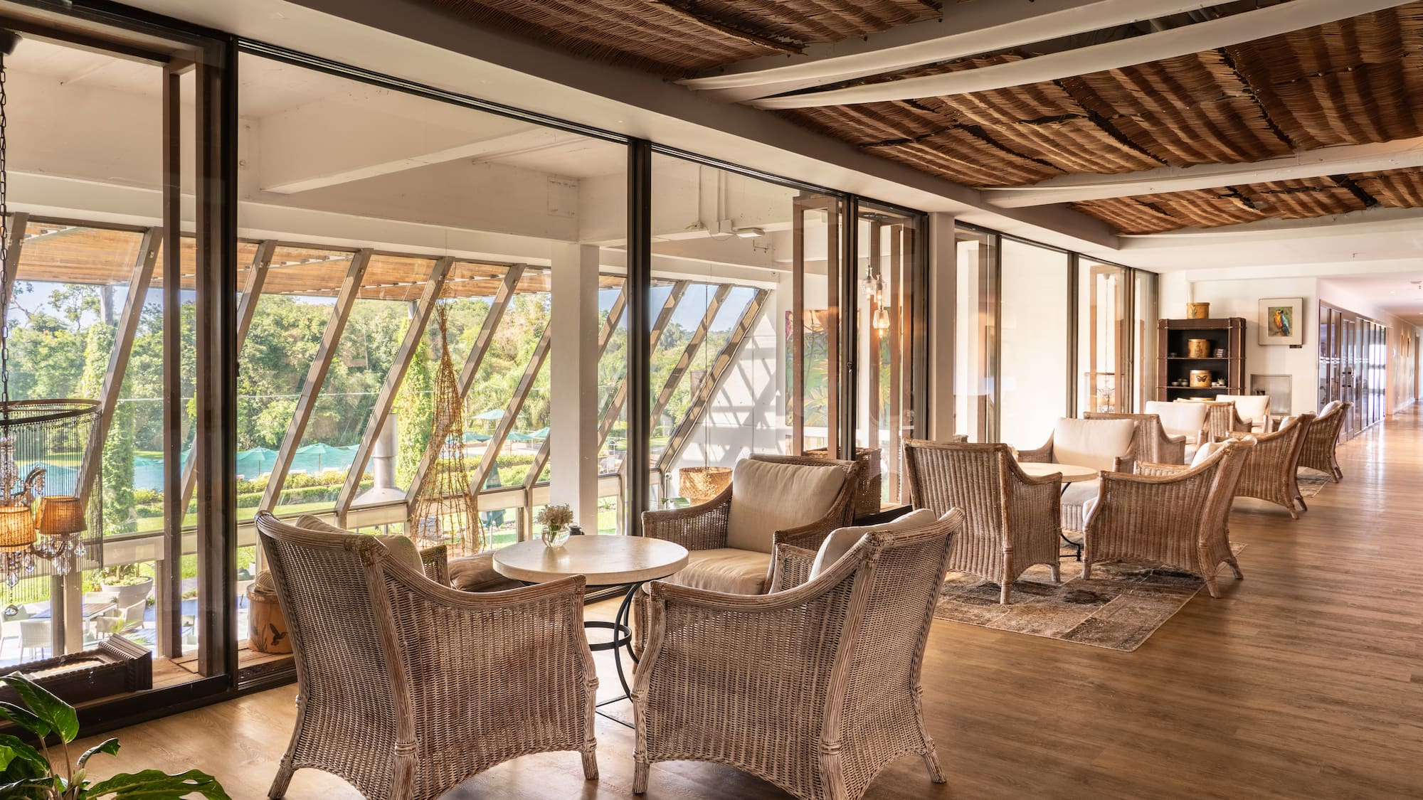 a room with wicker furniture and a table