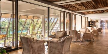 a room with wicker furniture and a table