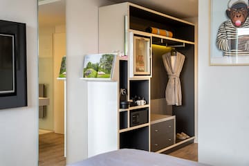 a room with a closet and a bed