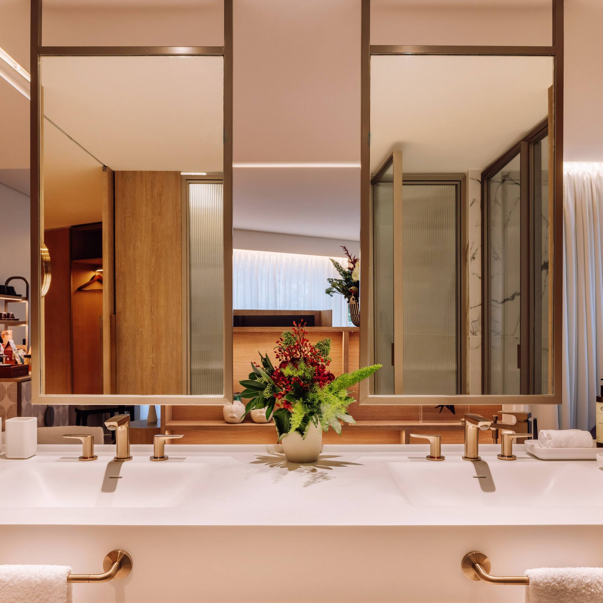 a bathroom with a plant on the counter