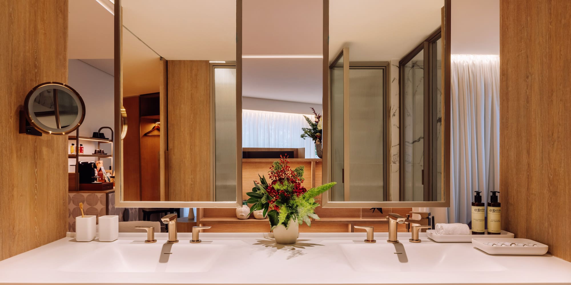 a bathroom with a plant on the counter