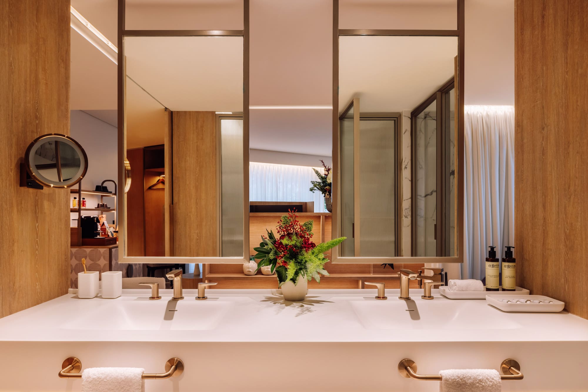 a bathroom with a plant on the counter
