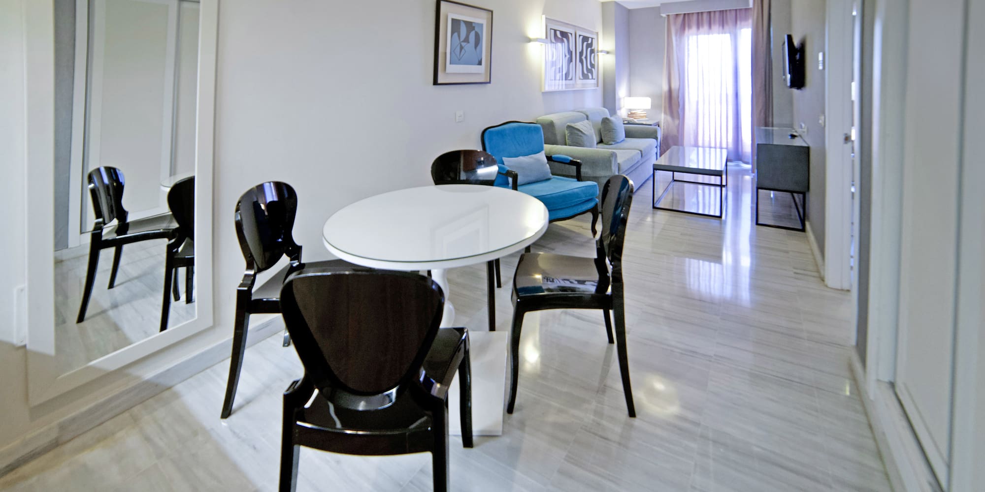 a room with a table and chairs