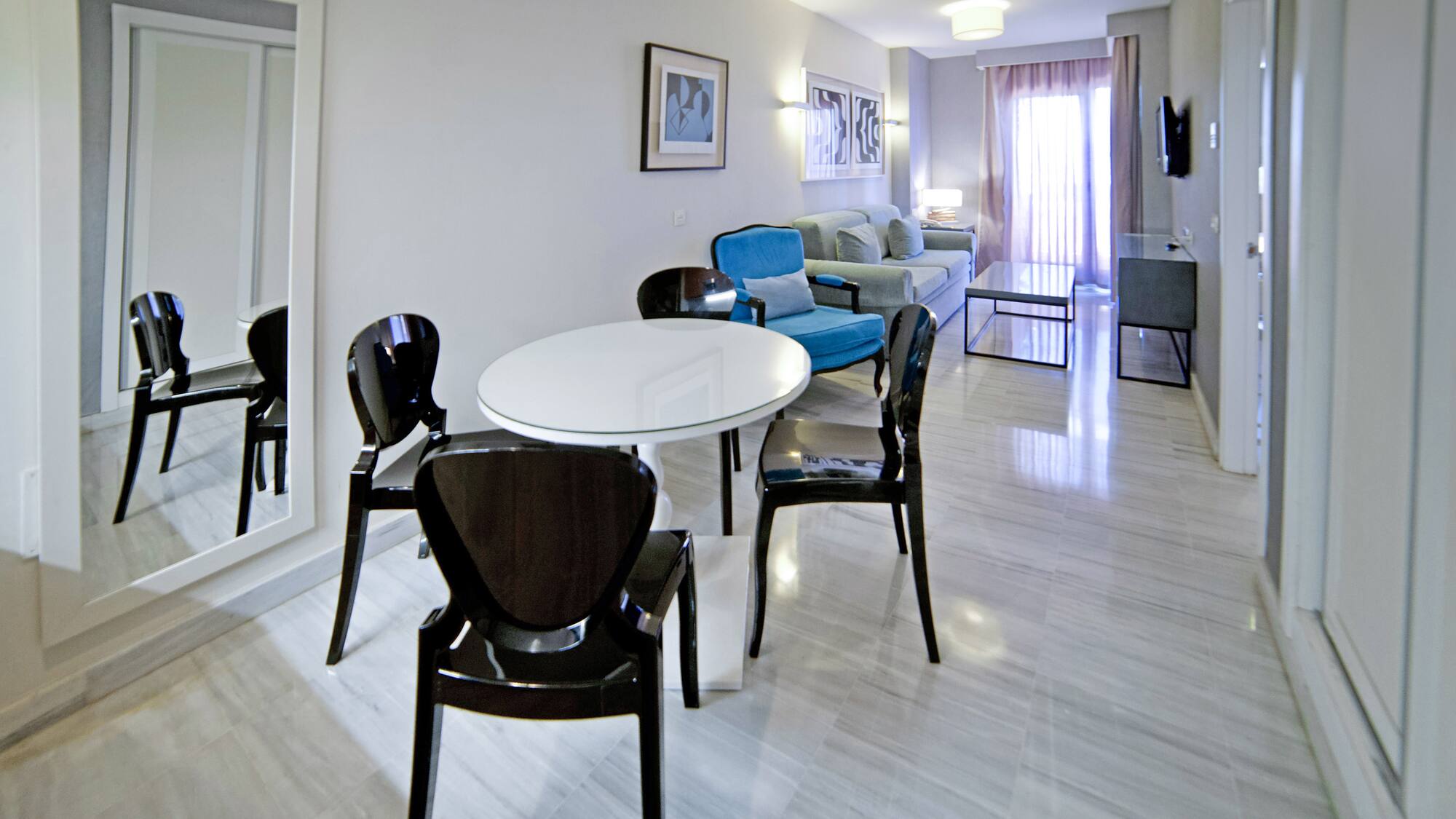 a room with a table and chairs