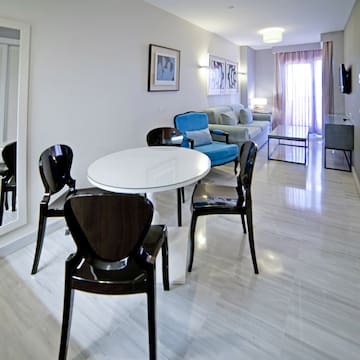 a room with a table and chairs