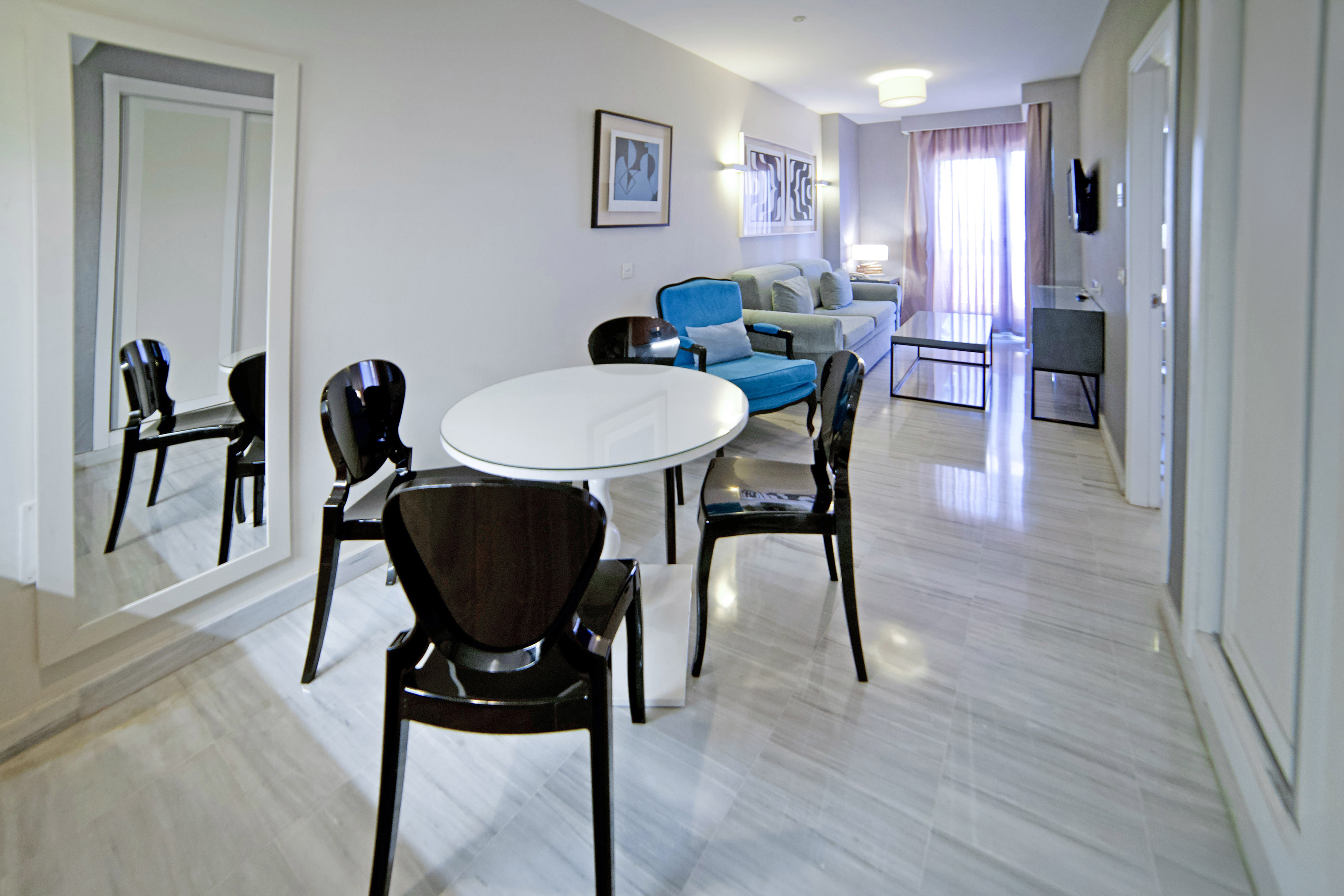 a room with a table and chairs