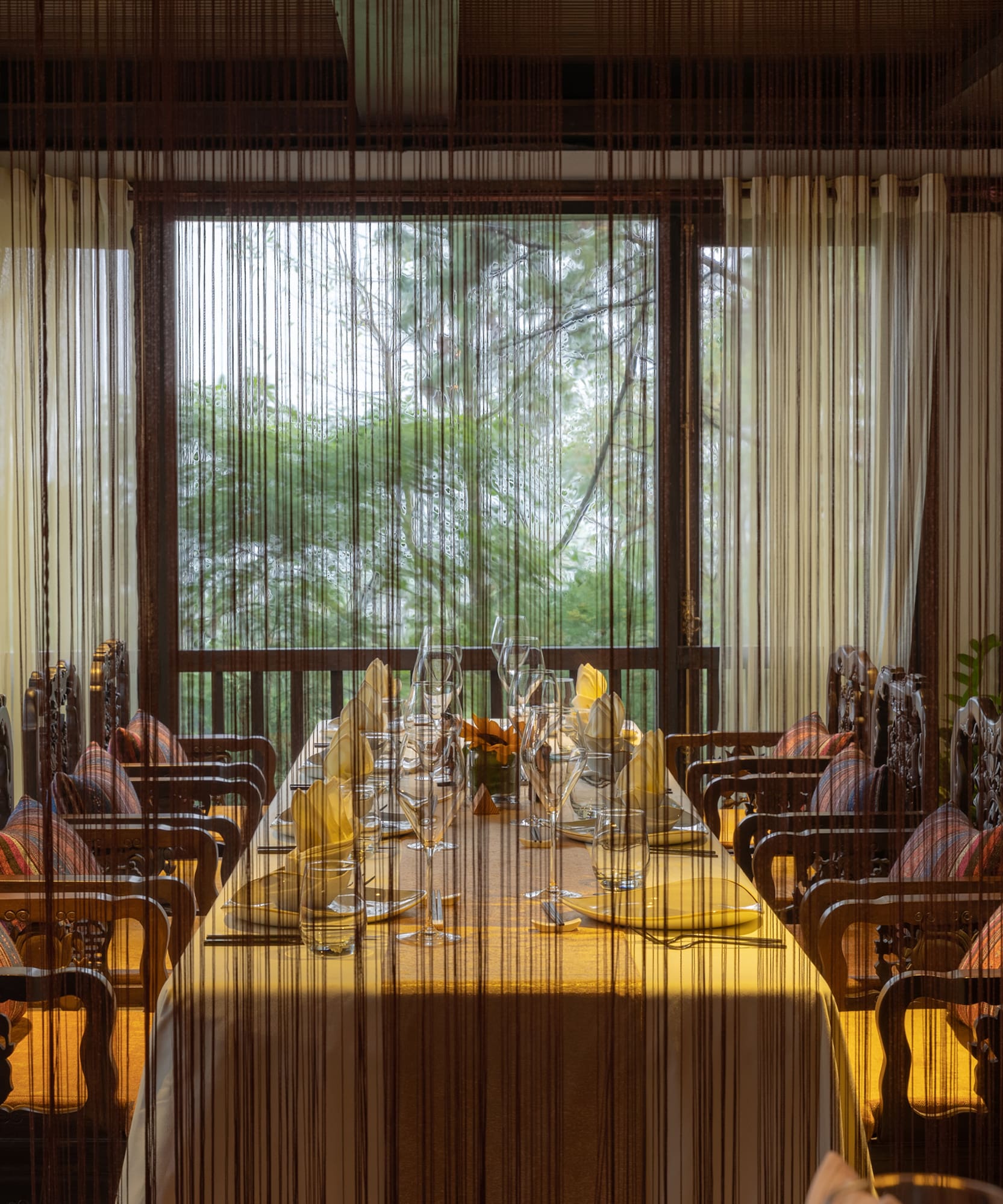 a dining room with a table and chairs