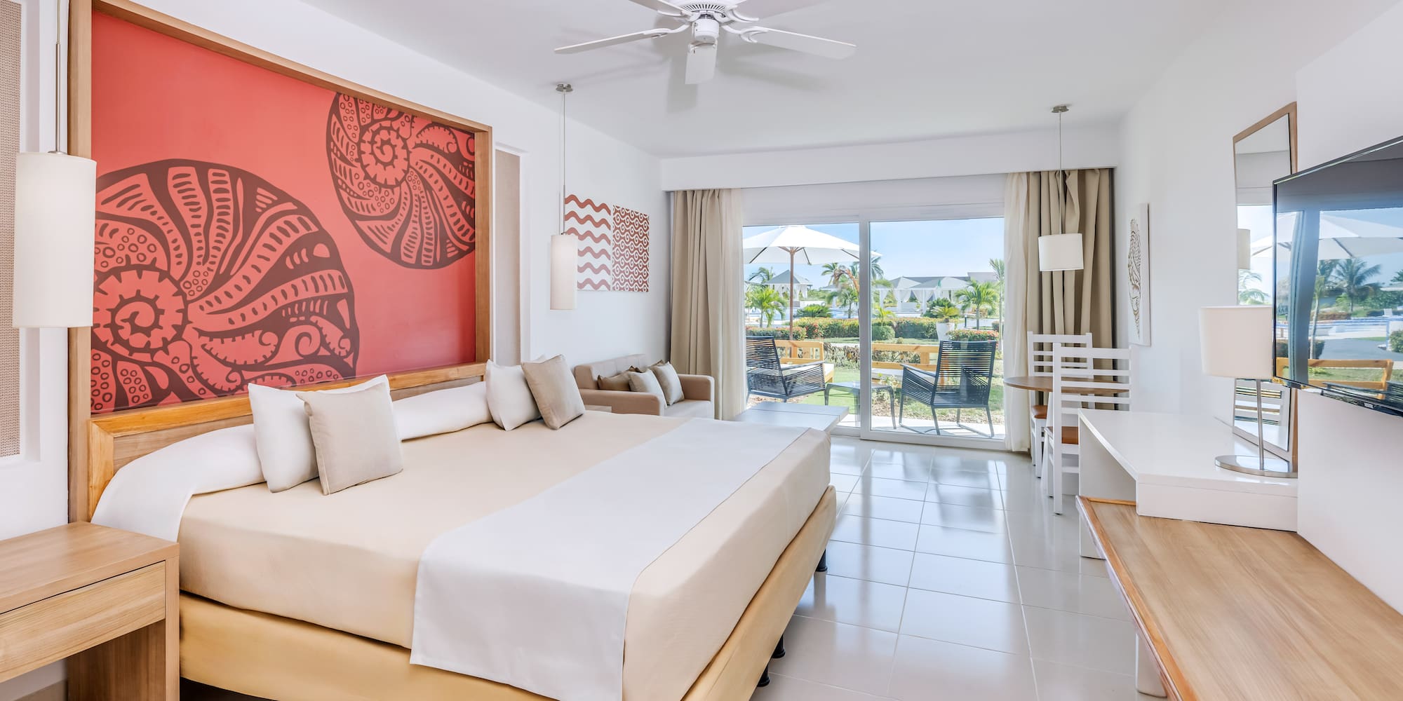 a room with a bed and a ceiling fan