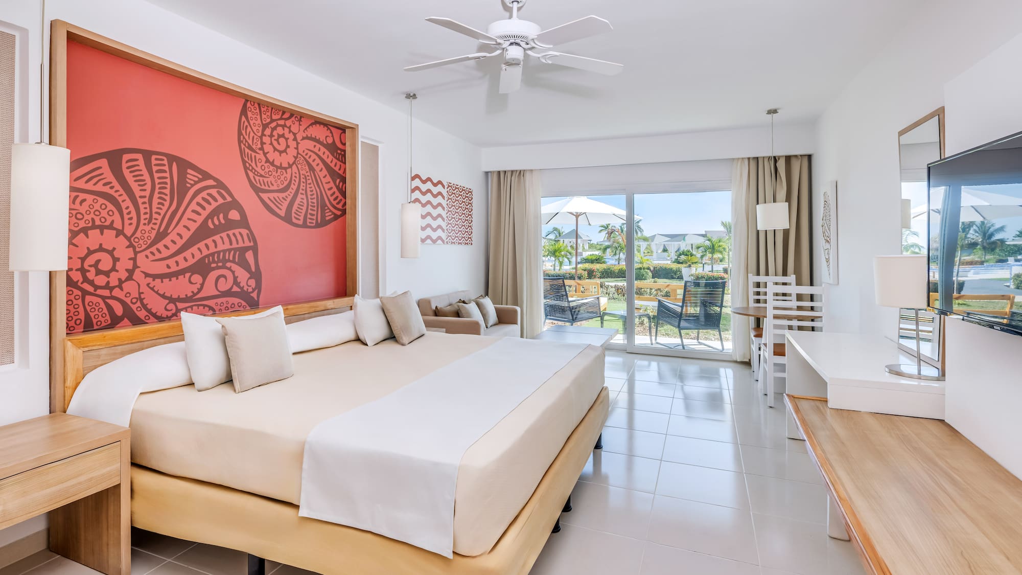 a room with a bed and a ceiling fan