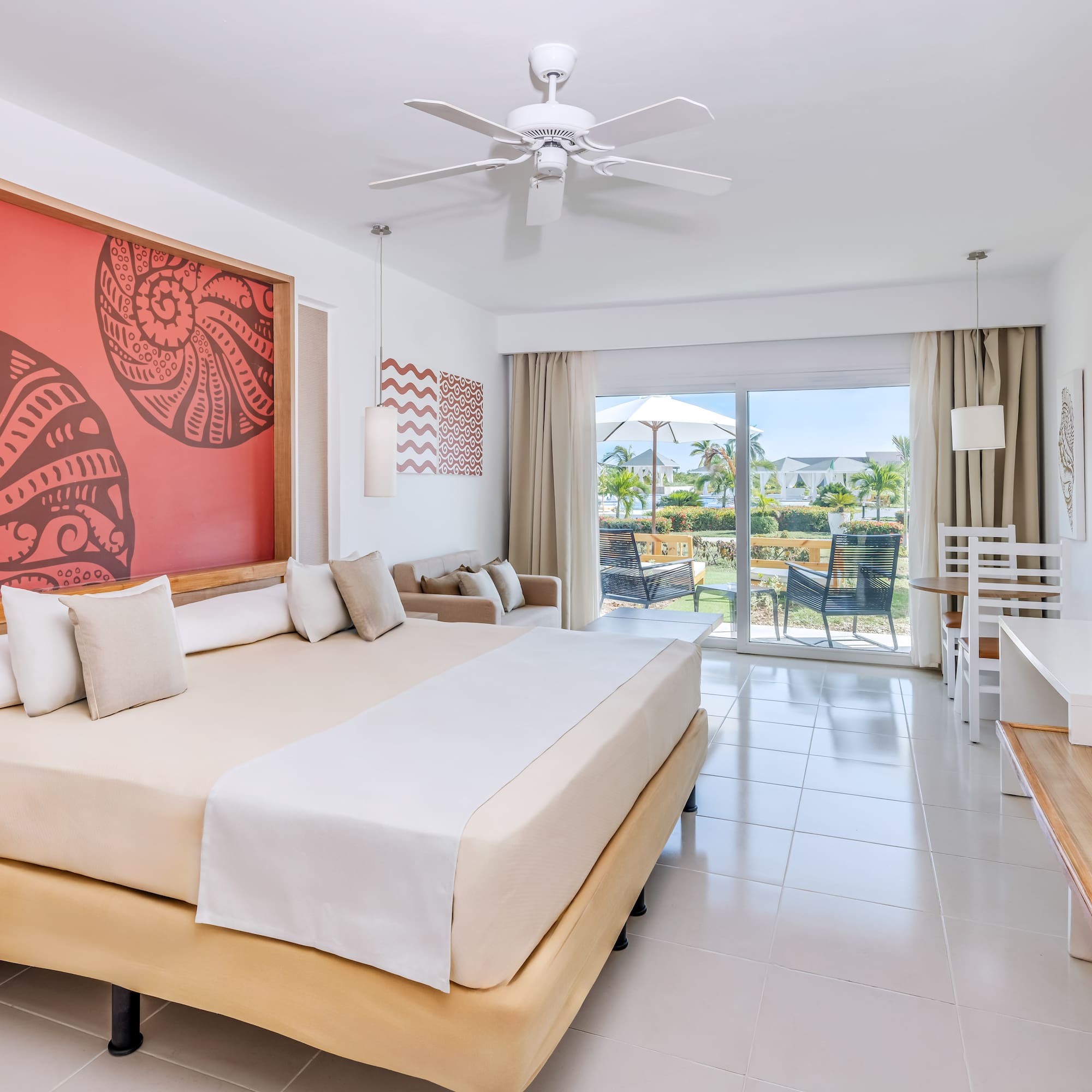 a room with a bed and a ceiling fan