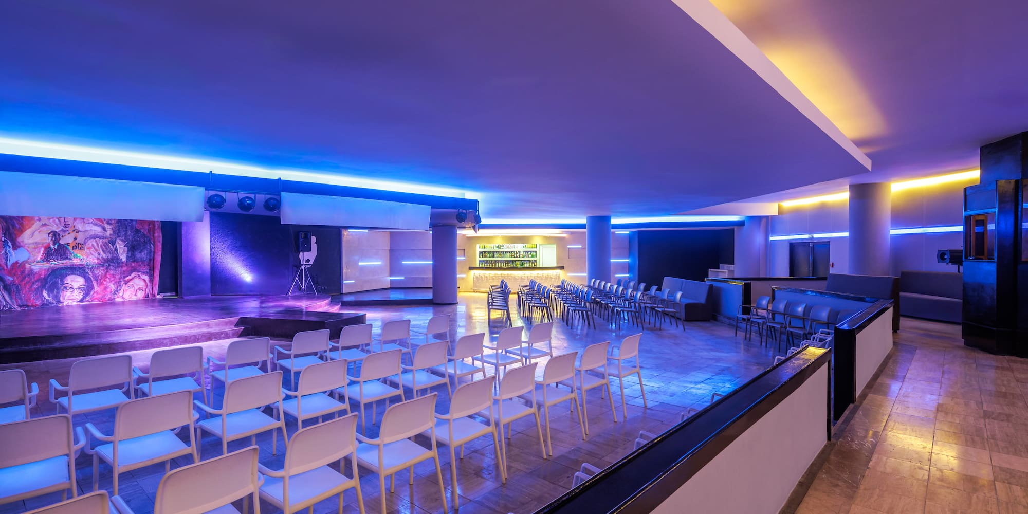 a room with chairs and a stage