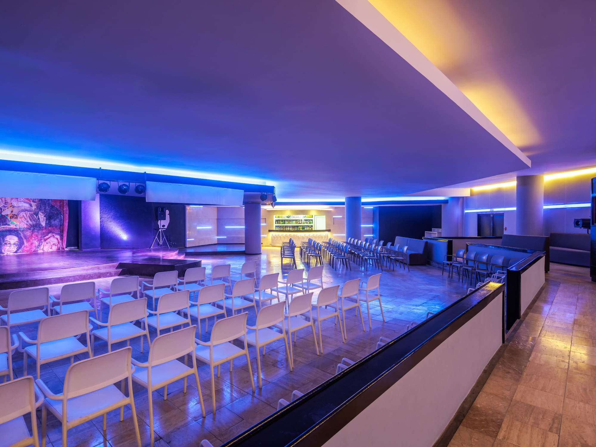 a room with chairs and a stage