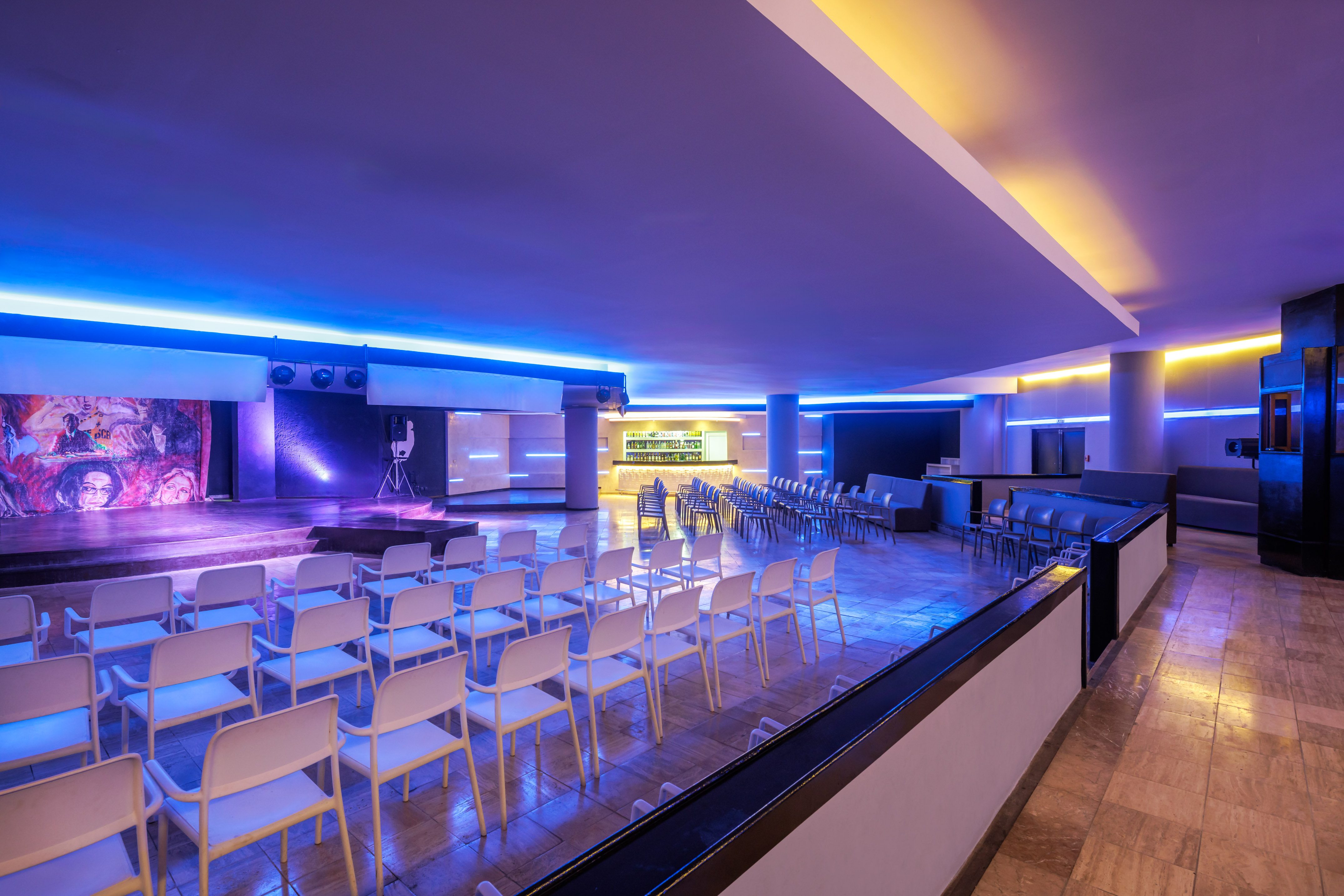 a room with chairs and a stage