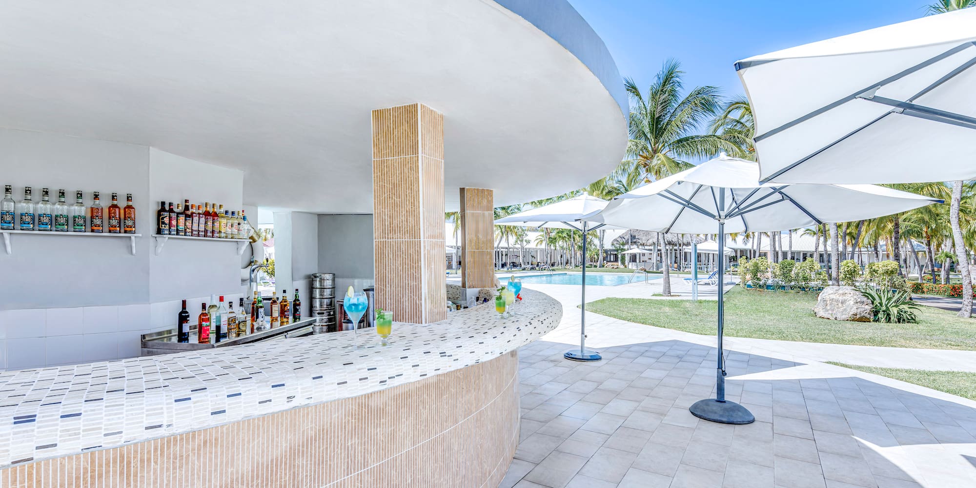 a bar with drinks on the counter