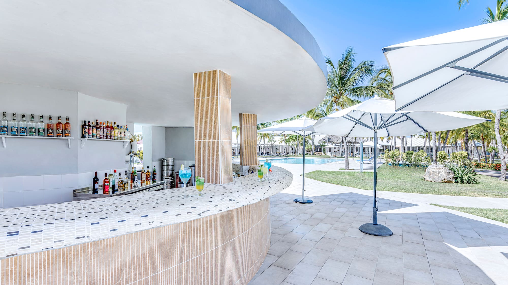 a bar with drinks on the counter