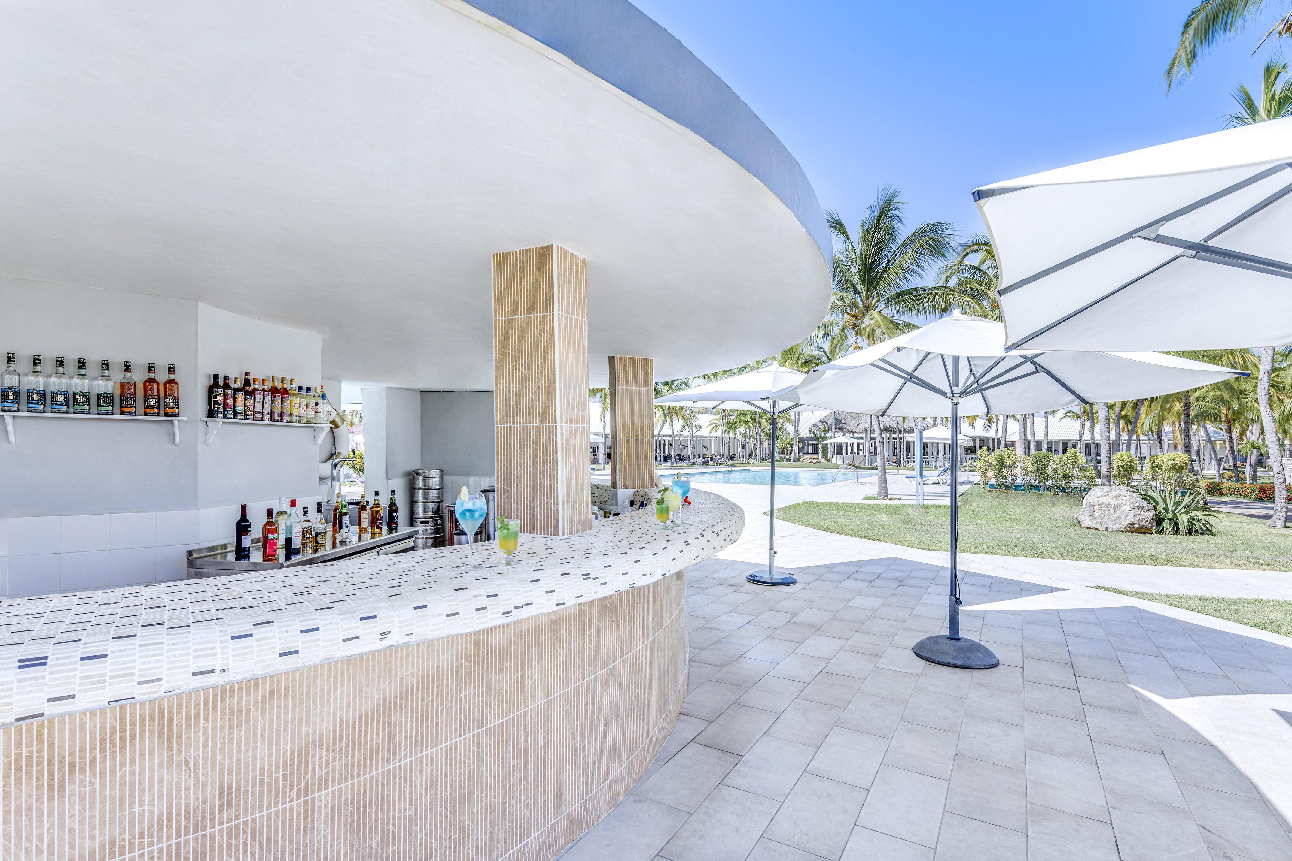a bar with drinks on the counter