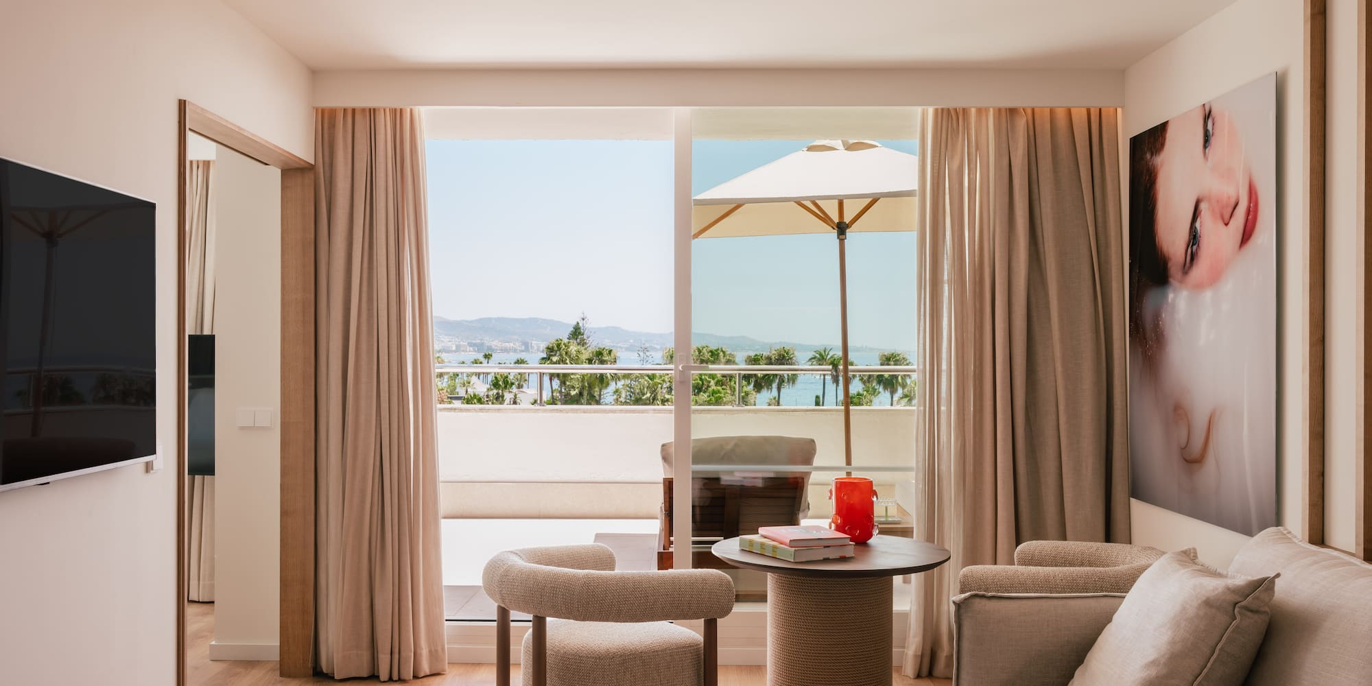 a living room with a table and chairs