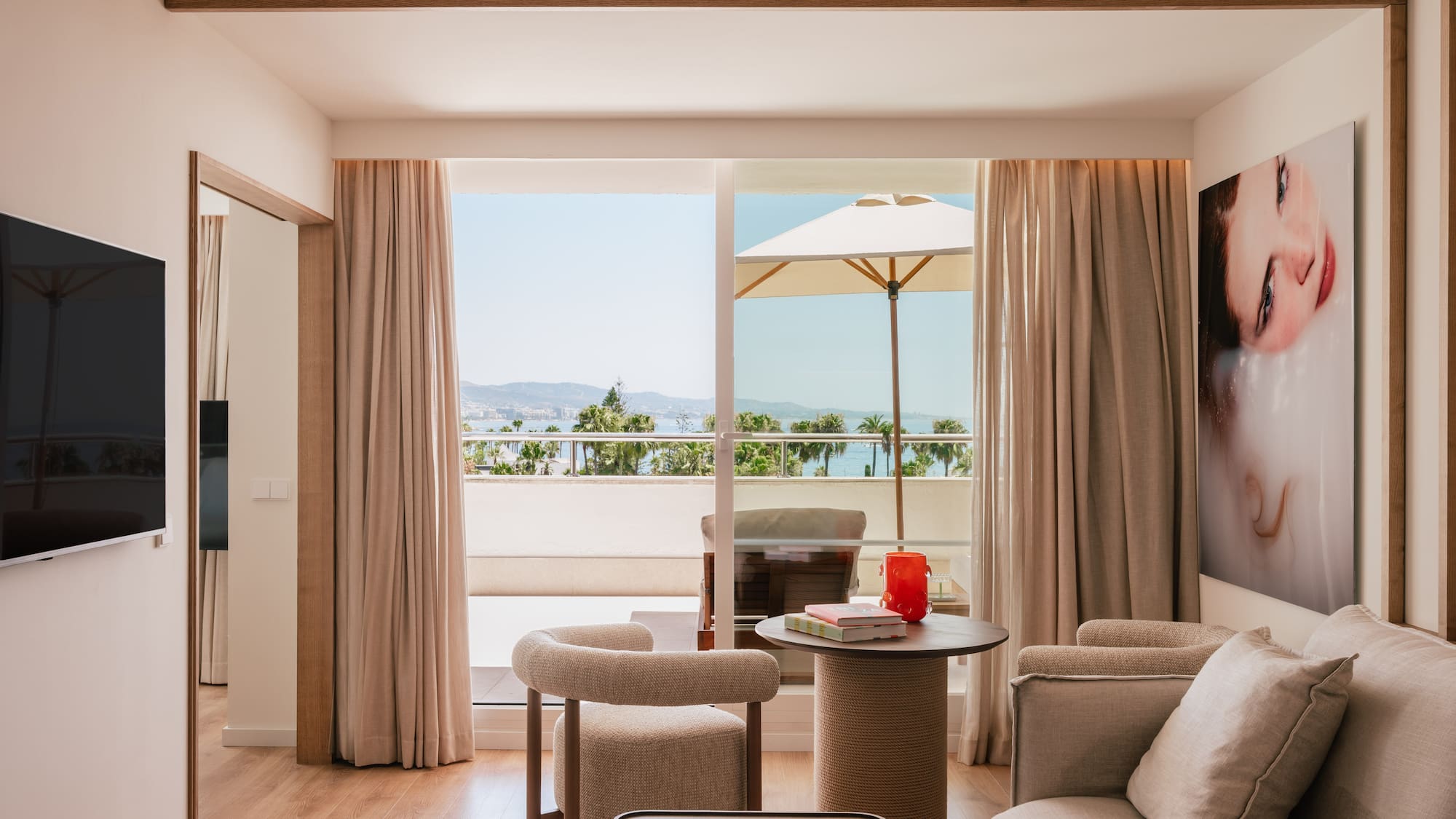a living room with a table and chairs