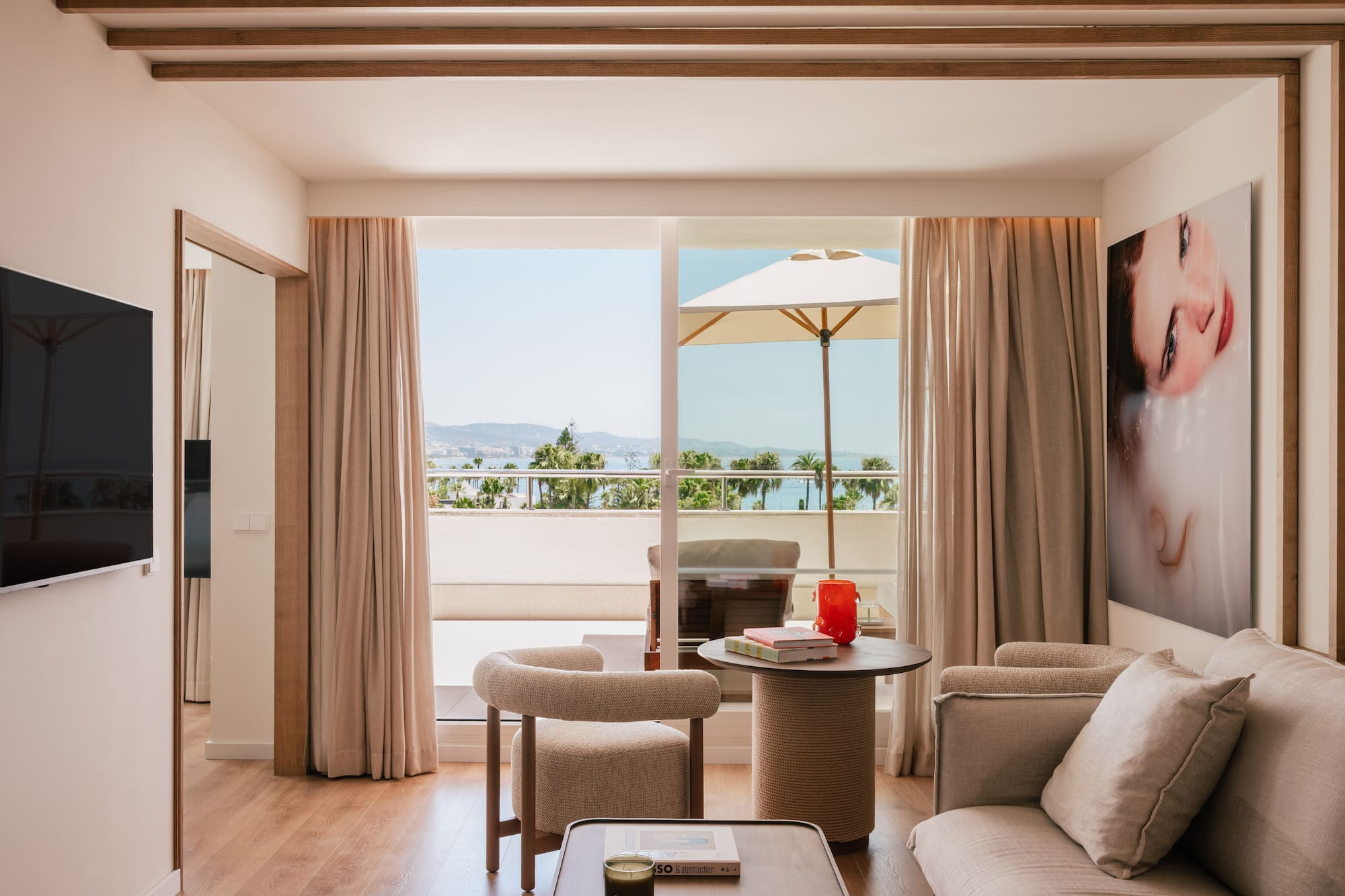 a living room with a table and chairs