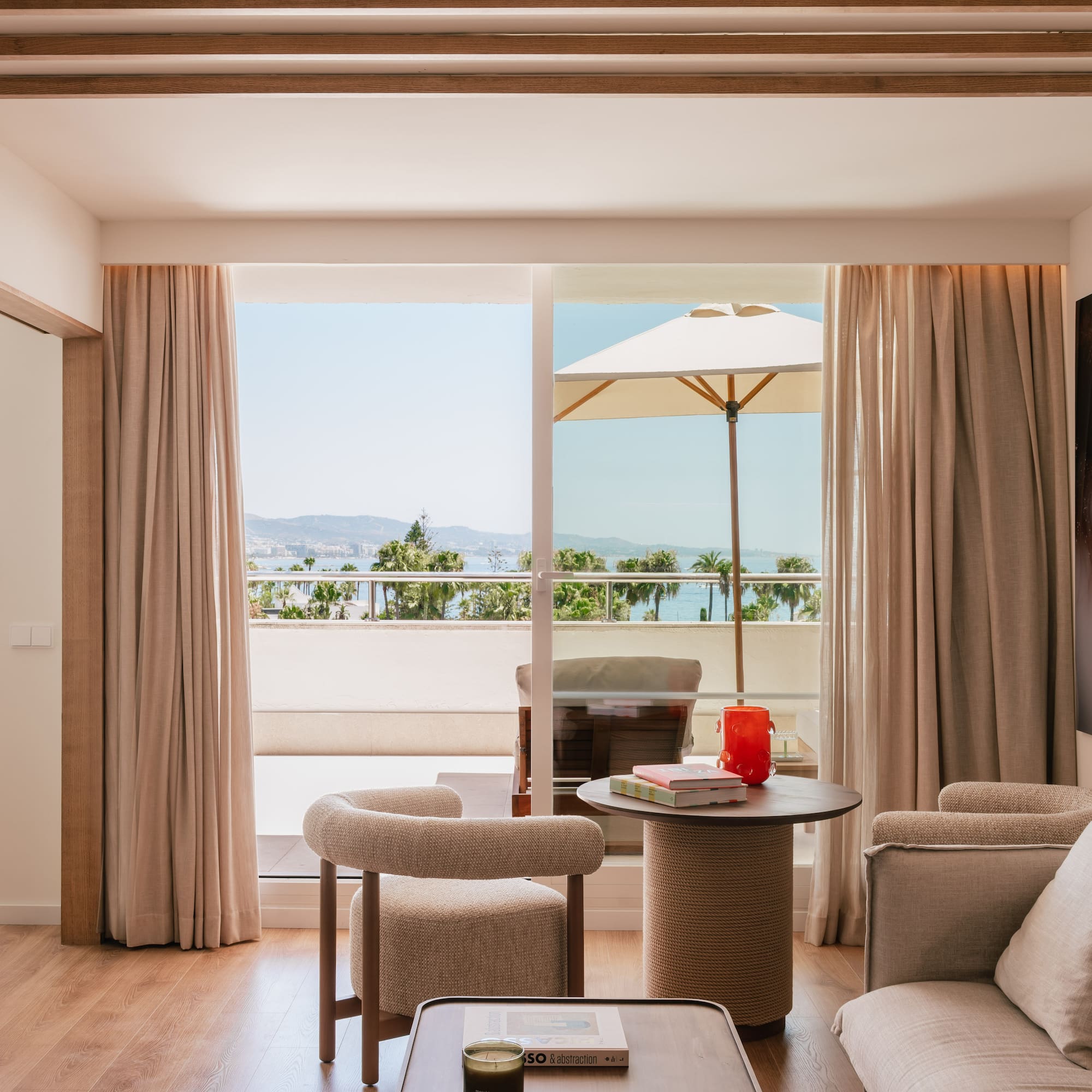 a living room with a table and chairs