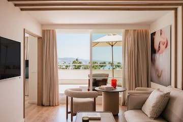 a living room with a table and chairs
