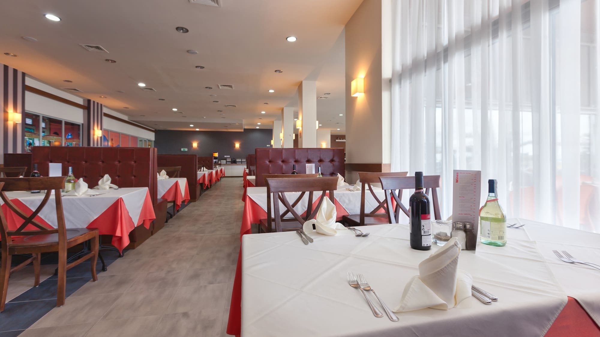 a restaurant with tables and chairs