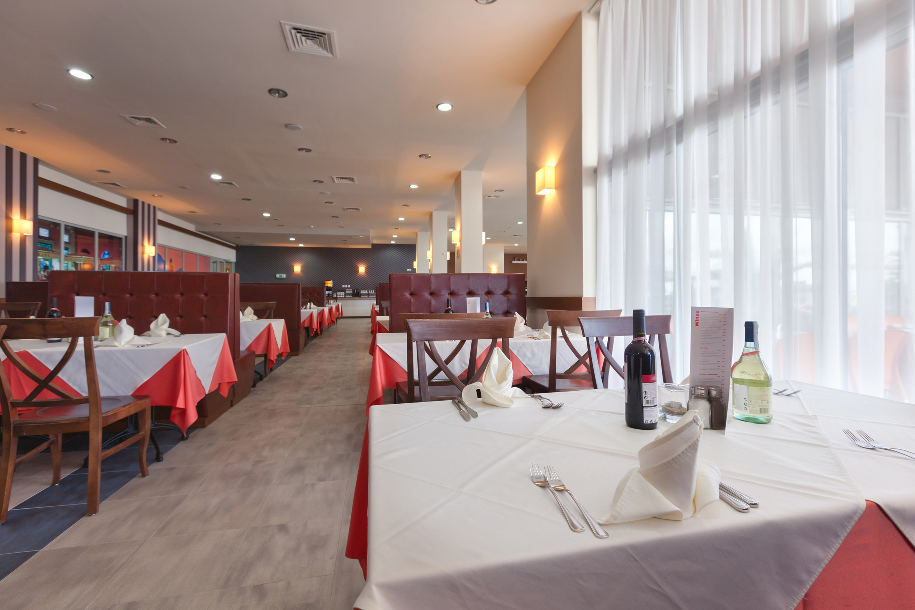 a restaurant with tables and chairs